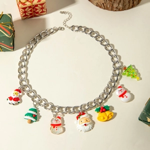 Detail of silver alloy chain necklace with Santa, snowman, and bell charms for Christmas