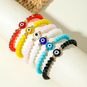 Set of six colorful bohemian evil eye beaded stretch bracelets with gold accents