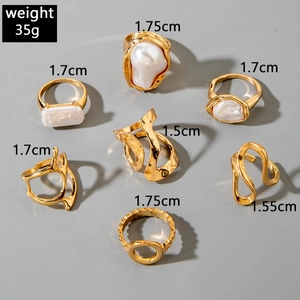 Detailed view of 7-piece gold alloy ring set with baroque pearls and size measurements
