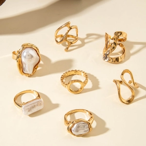 Modern 7-piece gold alloy ring set with baroque pearls and geometric irregular designs
