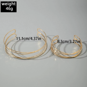 Detailed view of layered gold wire necklaces with 11.1cm and 8.3cm diameter specifications