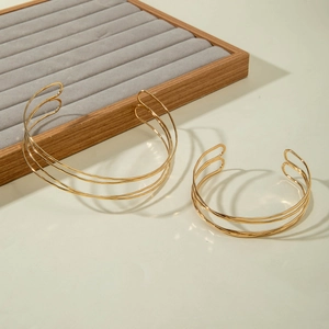 Polished gold multi-layer open cuff bracelet with minimalist retro layered line design
