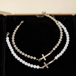 Elegant pearl and silver bead necklace set with cross pendant in black velvet jewelry box