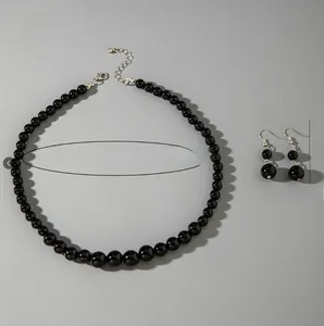 Detailed specs of black beaded necklace and earrings set with dimensions and weight
