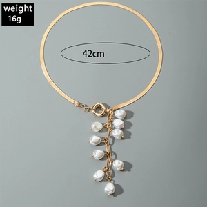 Detail of 42cm gold snake chain necklace with clustered white baroque pearl pendant