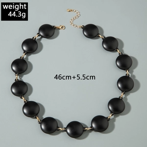 Detail of matte black acrylic bead necklace with gold links weighing 44.3g and 46cm long
