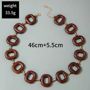 Detail view of bold brown acrylic necklace with gold links, weight 33.5g and length 46cm