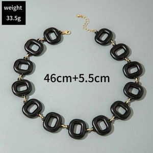 Detail view of chunky acrylic link necklace with gold metal connectors and 46cm length