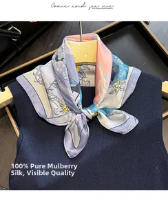 Detail of 100% mulberry silk floral scarf tied on a navy vest with smooth texture
