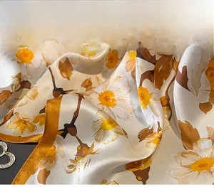 Close-up of precise hand-rolled edges and floral silk fabric with satin luster finish