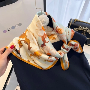Elegant light blue floral silk square scarf with satin finish and orange flower prints