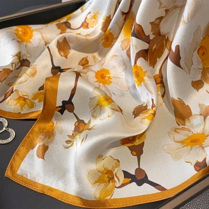 Elegant floral print silk scarf with yellow narcissus patterns and yellow hemmed edges