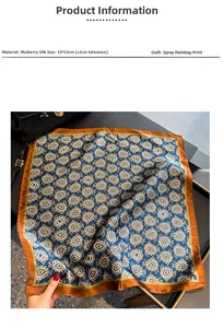Detailed mulberry silk scarf with paisley pattern on a handbag and dark table background