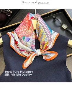 Detail of 100% mulberry silk scarf featuring colorful castle and giraffe patterns