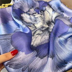 Elegant blue floral silk square scarf with artistic petal print and satin finish