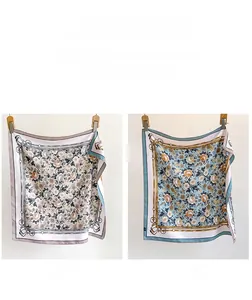Close-up of double-sided silk twill scarf with vintage floral patterns on both sides