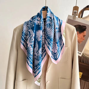 French vintage floral silk square scarf in navy blue and pink styled on a beige blazer