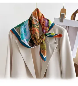 Detailed view of floral oil painting silk scarf tied on a beige blazer collar