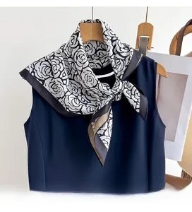Detailed view of premium twill silk scarf with black and white rose floral printing
