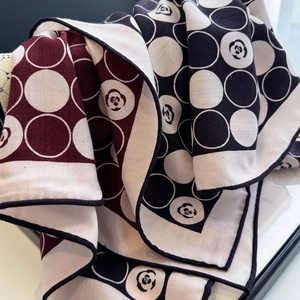 Silk wool scarf featuring camellia polka dots and contrast roll edges in burgundy and black