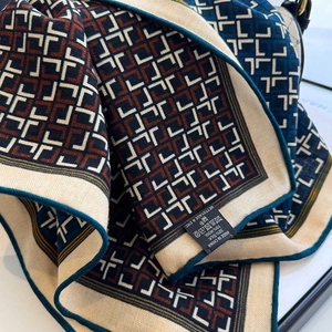 70% Wool 30% Silk geometric monogram scarf in navy blue and brown with rolled edges