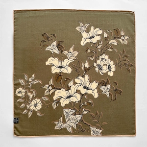 Detailed view of olive green wool silk scarf with elegant hand-painted floral patterns