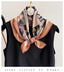 Artistic silk and wool blend scarf with abstract bird and floral print tied at the neck