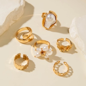 6-piece gold ring set with baroque pearls and hollow floral designs on stone