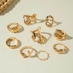 Nine-piece gold geometric ring set featuring irregular wave and minimalist stacked designs