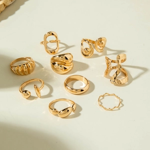 9-piece set of gold geometric rings featuring irregular and textured minimalist designs