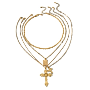 Gold layered necklace set with cross pendants and religious icon coin on white background