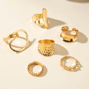 6-piece set of gold geometric rings featuring irregular hollow designs and hammered textures