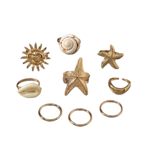 9-piece gold boho ring set with starfish, sun, and sea shell beach vacation charms