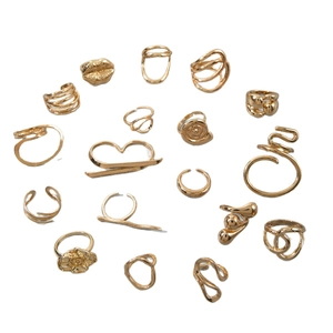 17-piece gold geometric ring set with rose, lip, and spiral hollow designs