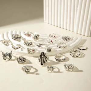 Detailed set of Gothic silver rings featuring skull, bat and coffin designs in vintage style