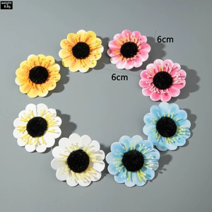 Close-up of 8pcs colorful 6cm artificial sunflower earrings with detailed soft textures
