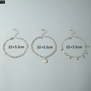 Three-piece silver chain anklet set with heart lock and bead charms weighing 11.9g