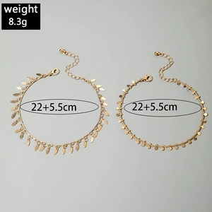 Detailed view of gold multi-layered anklet set with leaf charm and 8.3g weight specs
