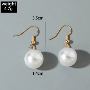 Detail view of pearl drop earrings with size measurements of 3.5cm height and 1.4cm diameter