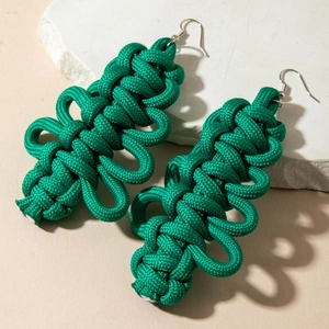 Handmade green woven Christmas tree earrings with bohemian style and silver hooks
