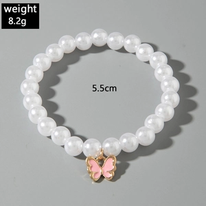 Bracelet de perles élastique avec breloque papillon émaillée rose de 5,5 cm de diamètre