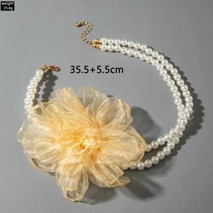 Detail view of double-layer pearl necklace with organza flower and size specs