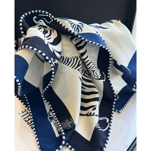 Blue and white zebra pattern wool silk scarf with elegant geometric blocks and stripe border