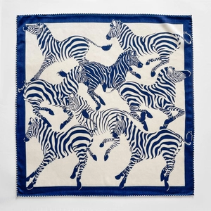 Double-sided silk wool scarf featuring navy blue and cream zebra animal print patterns