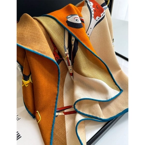 Equestrian print silk wool scarf with horse saddle pattern and blue hand-rolled edges