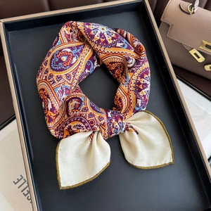 Silk wool scarf with vintage purple paisley pattern tied in an elegant knot style