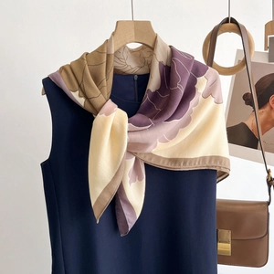 Elegant floral print square scarf with purple and earth tones styled on a dress