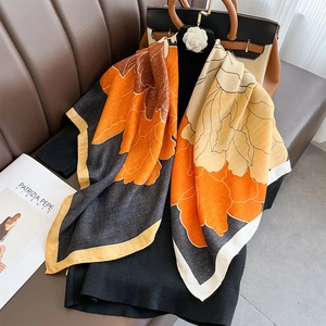 Elegant floral print silk scarf with orange and beige abstract patterns for women