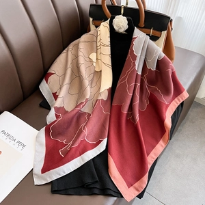 Large floral print square scarf with red and beige hand-painted patterns on black top