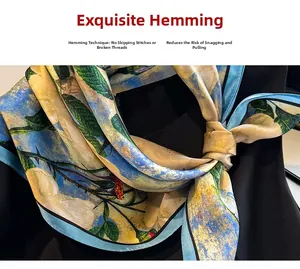 Close-up of sky blue silk scarf with oil painting floral patterns and delicate stitching